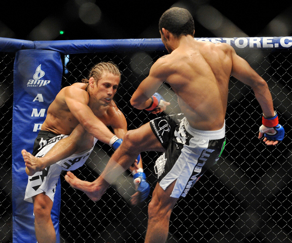 Jose Aldo kicks the leg right out from under Urijah Faber